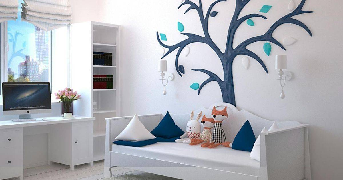 Modern living room with nature-themed wall stickers of trees, leaves, and birds