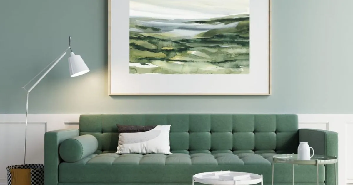 Green accent wall complements neutral decor in this modern space