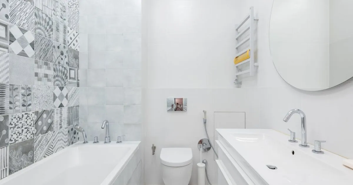 Spacious bathroom featuring bright colors and depth in design elements