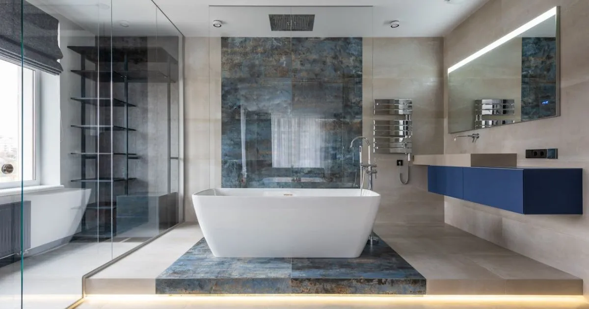 Modern bathroom featuring unique mosaic tile pattern and earthy textures