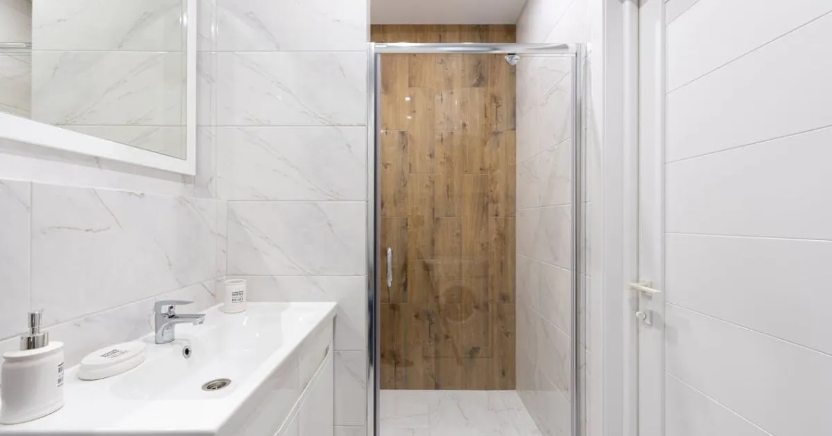 Cozy wooden bathroom door adding warmth and natural style to the space.